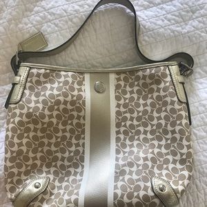 Gold and white Coach purse